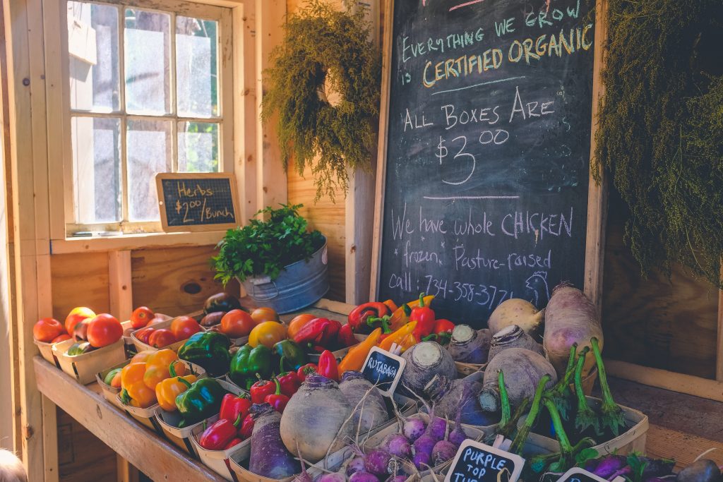 An organic farmer's booth at a local market