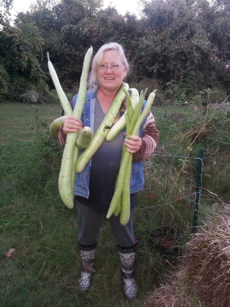 Woman holding produce from the garden