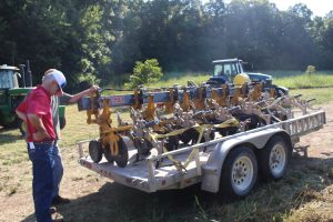 An image of Missouri farmers learning at the Missouri Organic Association's August workshop and field day