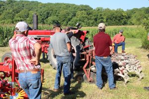 An image of Missouri farmers learning at the Missouri Organic Association's August workshop and field day