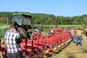 An image of Missouri farmers learning at the Missouri Organic Association's August workshop and field day