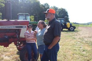 An image of Missouri farmers learning at the Missouri Organic Association's August workshop and field day